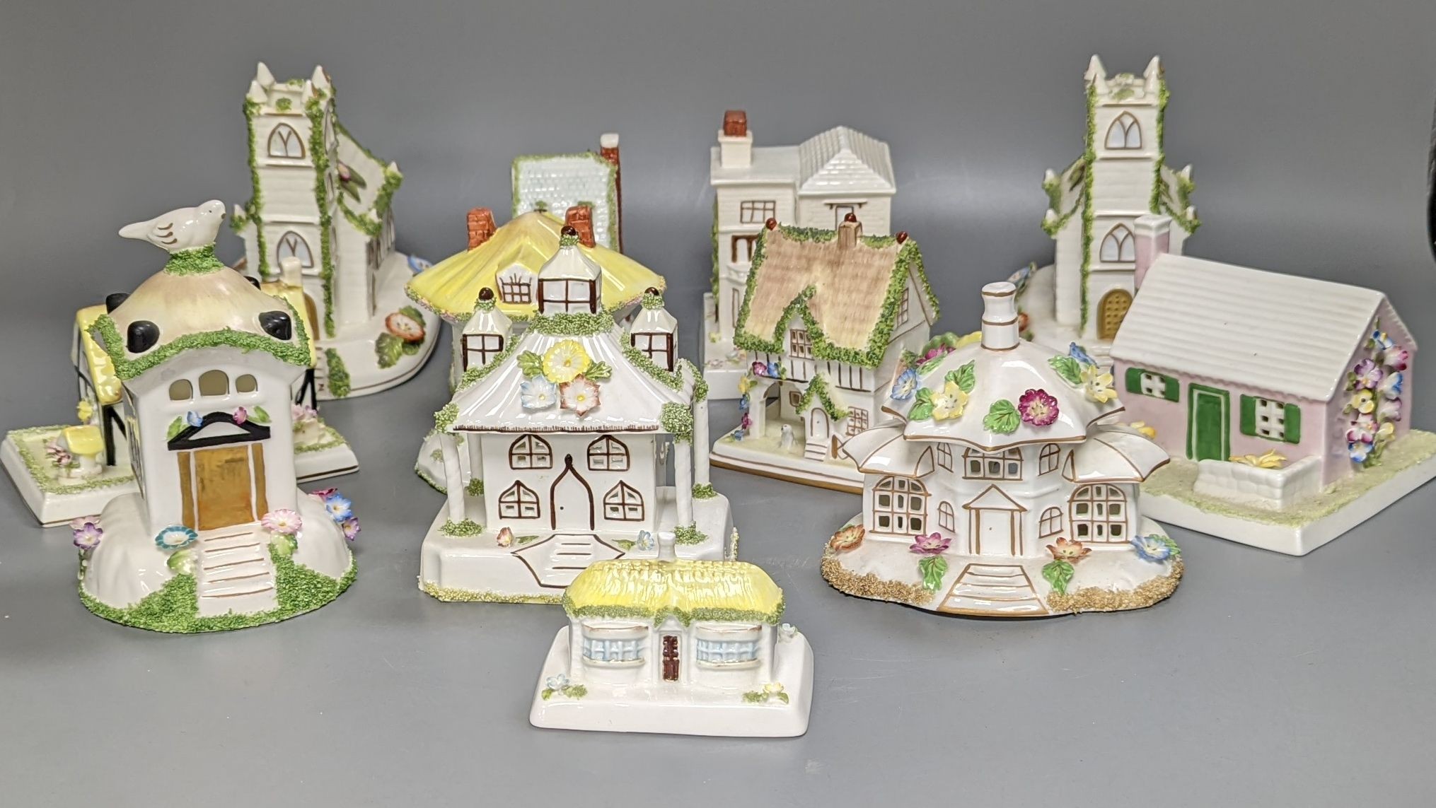 Twelve Coalport bone china pastille burner cottages and other buildings, tallest 14cms high
